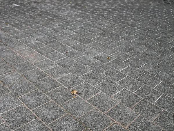 Abstrait brique carrée fond de rue, texture de matériau de pierre — Photo