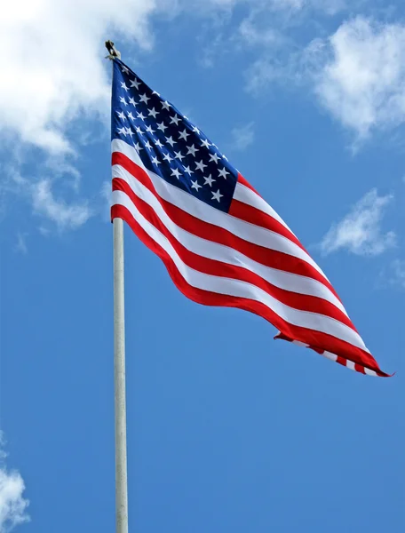 stock image American flag on blue sky, freedom