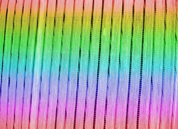Arco-íris têxtil closeup, pano de fundo abstrato — Fotografia de Stock