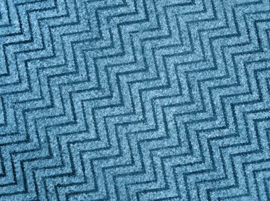 Abstract blue zigzag carpet background texture, wool. clipart