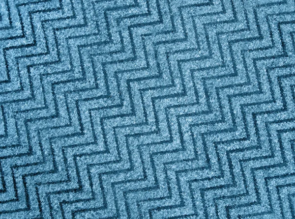 Absztrakt kék, cikcakkos szőnyeg háttér textúra, gyapjú. — Stock Fotó
