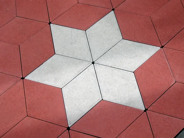 Kırmızı beton zemin üzerinde soyut yıldız. — Stockfoto