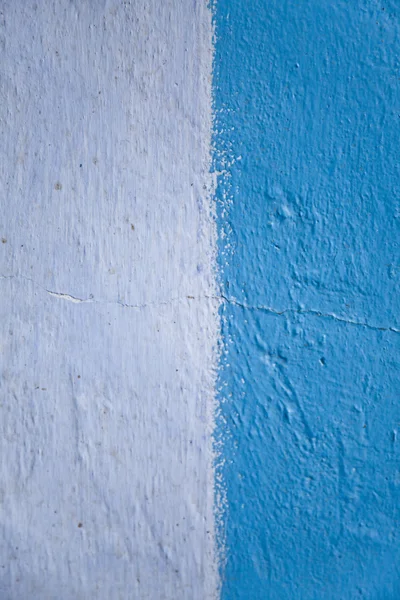 Old cracked wall with two colours blue and white for background. — Stock Photo, Image