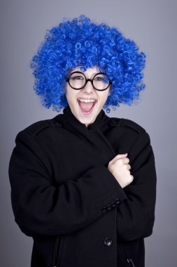 Funny blue-hair girl in glasses and black coat. clipart