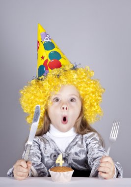 Portrait of young girl at birthday with cake. clipart