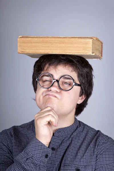 Young men thoughtful men with book over head. — Stock Photo, Image