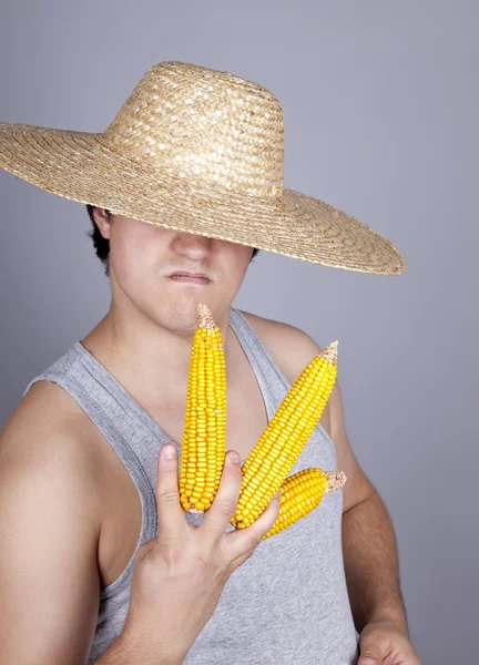 Aggressive farmer show three corns. — Stock Photo, Image