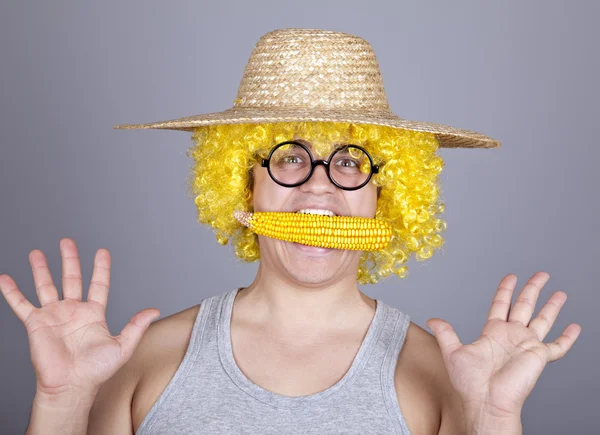 Funny farmer keep corn in mouth. — Stock Photo, Image