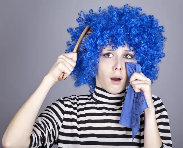 Portrait of sad girl with blue hair and comb. — Stock Photo, Image