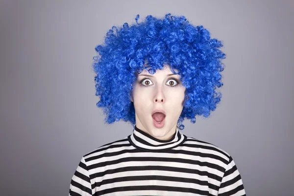 Surprised blue hair girl with stuck comb. — Stock Photo, Image