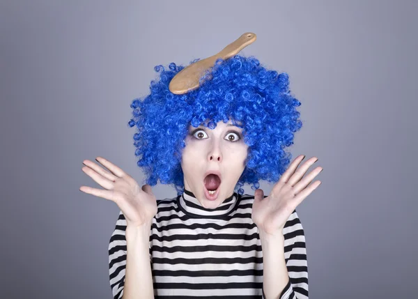 Surprised blue hair girl with stuck comb. — Stock Photo, Image