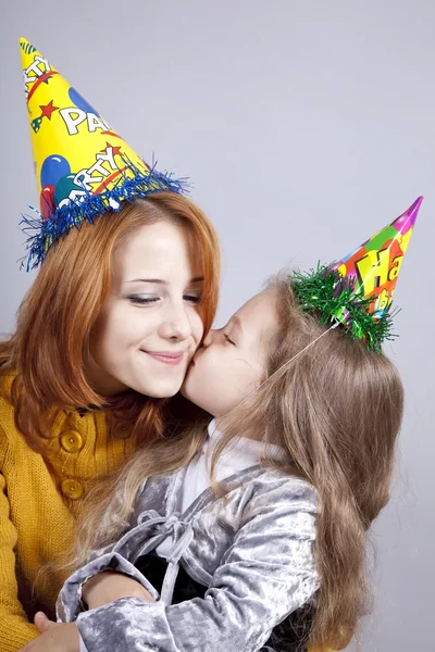 Two sisters four and eighteen years old at birthday. — Stock Photo, Image