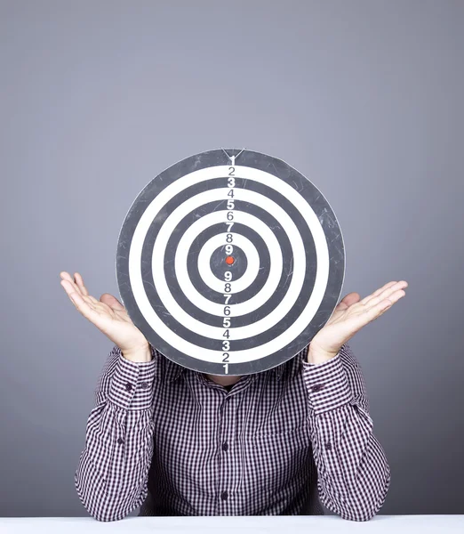 Boy with dartboard in place of head. — Stock Photo, Image
