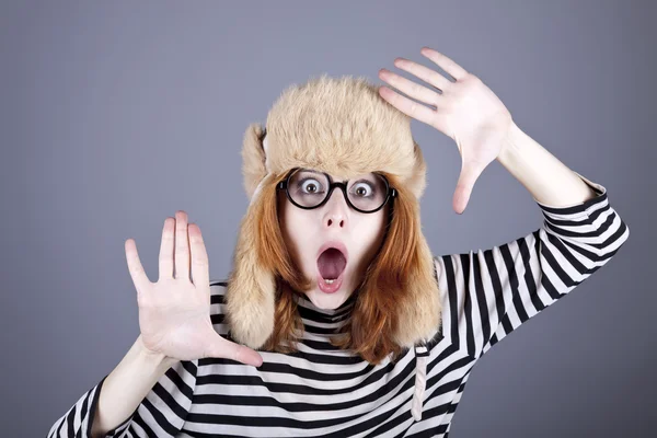 Surprise girl in winter cap and glasses. — Stok fotoğraf