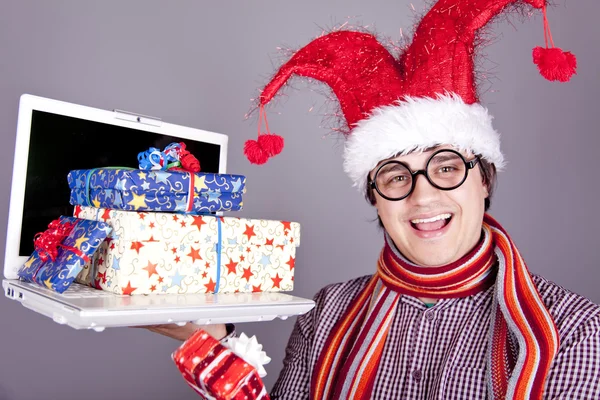 Funny men in christmas cap with gift boxes and notebook. — Stock Photo, Image