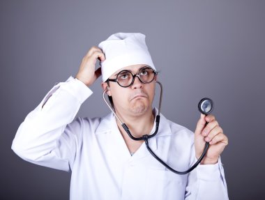 Crazy doctor with a stethoscope. clipart