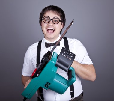 Men in suspender with bow tie and glasses keeping portable saw clipart