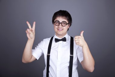 Portrait of funny fashion men in suspender with bow tie and glas clipart