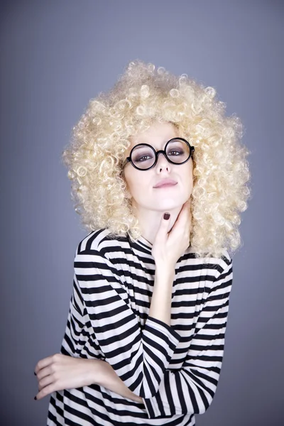 Portrait of feared girl in blonde wig. — Stock Photo, Image