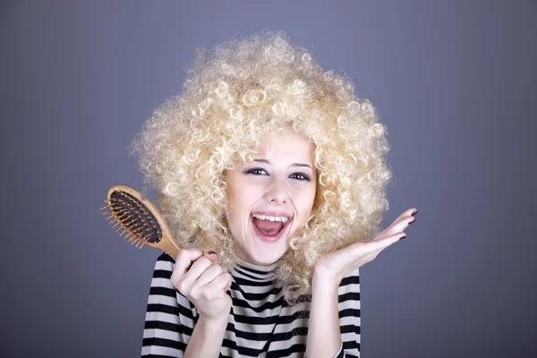 Surprised girl with comb. — Stock Photo, Image
