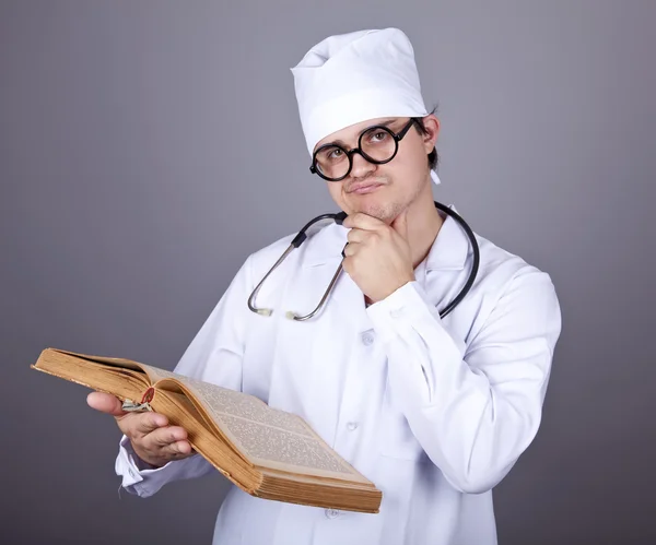 Young doctor with book. — Stock Photo, Image