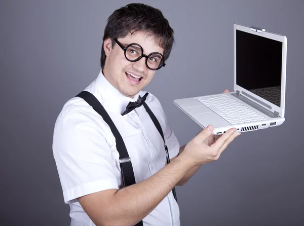 Men in suspender with bow tie and glasses keeping notebook. — Stock Photo, Image