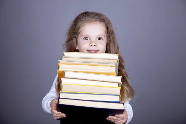 Küçük kız öğrenci witn kitaplar. — Stok fotoğraf
