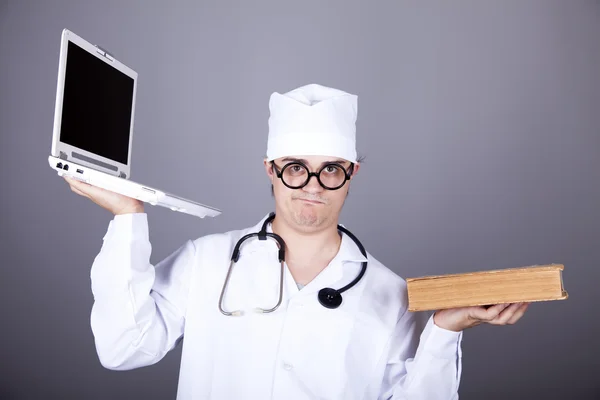Shouting doctor with notebook. Stock Picture