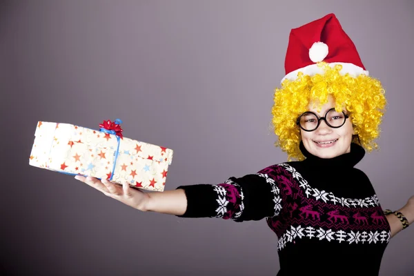 Funny girl in glasses with christmas gifts. — Stock Photo, Image