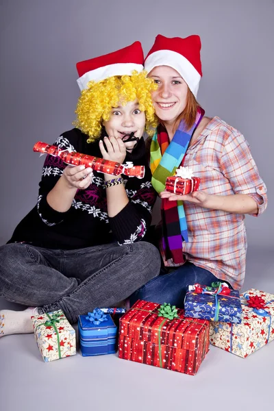 Two funny girls with christmas gifts. — Stock Photo, Image
