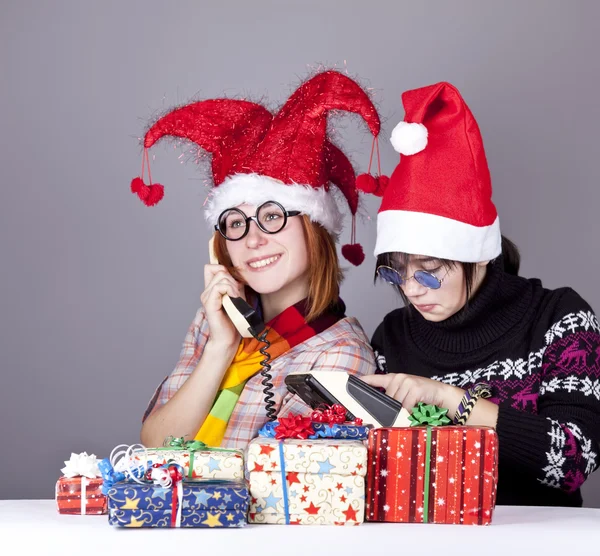 Two girls calling to Santa for better christmas gift. — Stock Photo, Image