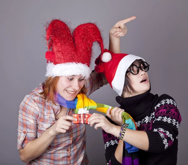 Two funny girls with christmas gifts. — Stock Photo, Image