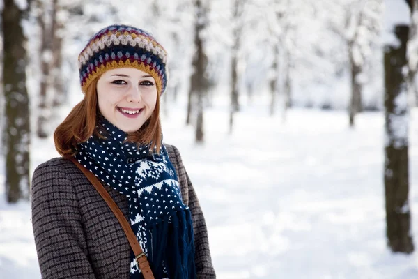 stock image Beautiful young red-haired woman in winter park