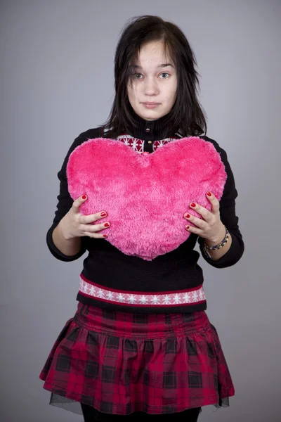 Funny girl with toy heart. — Stock Photo, Image