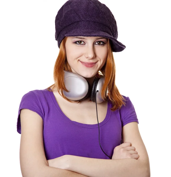 Schöne rothaarige Mädchen mit Kopfhörern. s — Stockfoto