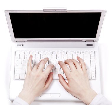 Human hands over laptop keypad during typing. clipart