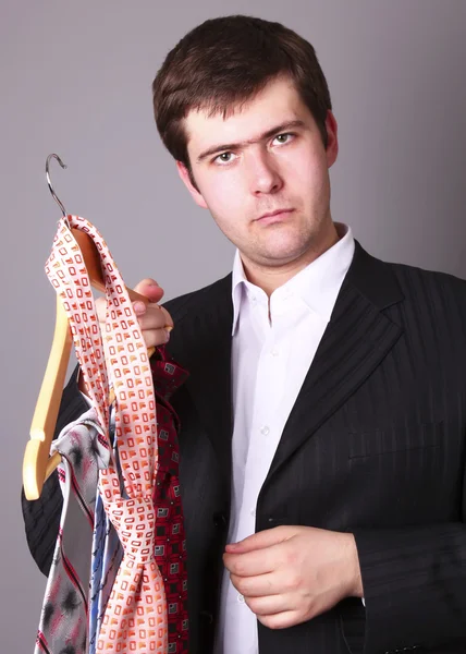 Businessman can't select a tie — Stock Photo, Image