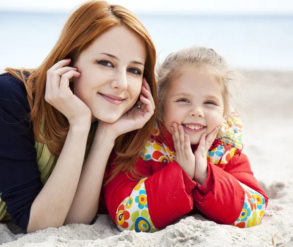 Two sisters at the beach in spring day. — Stock Photo, Image