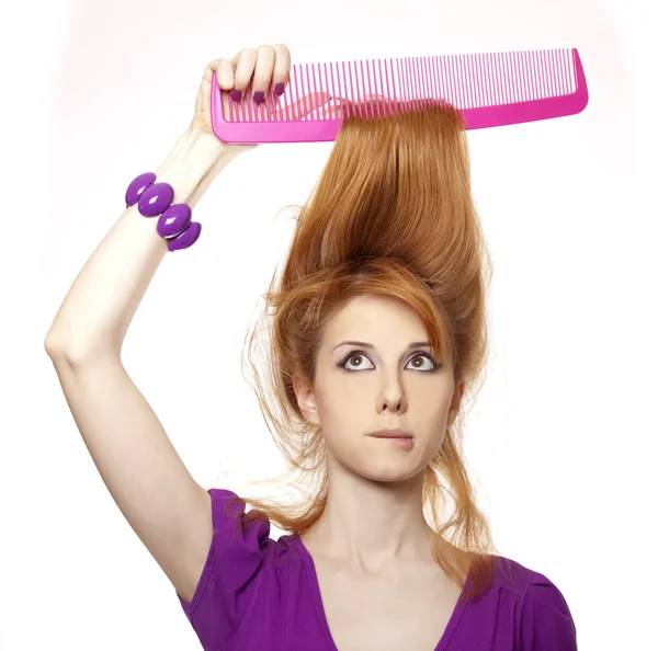 Funny red-haired girl with big comb. — Stock Photo, Image