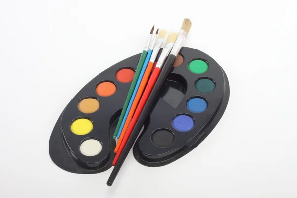 Brushes and palette — Stock Photo, Image