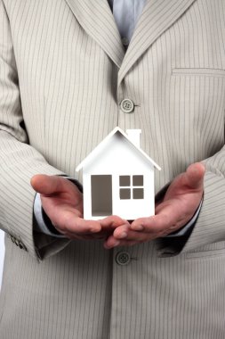 House model in hand clipart