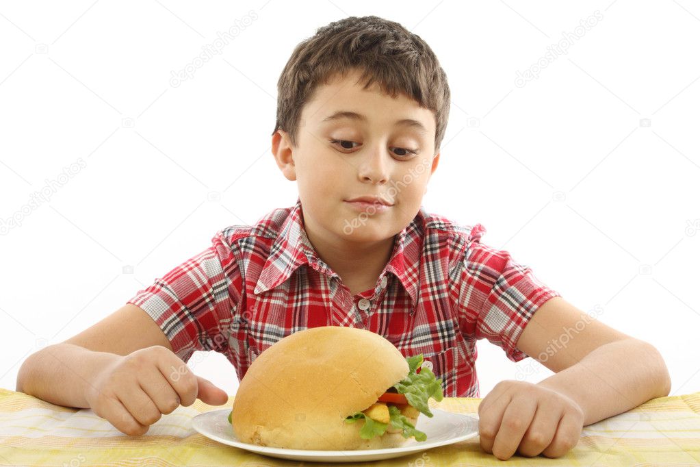 Boy eating a big hamburger