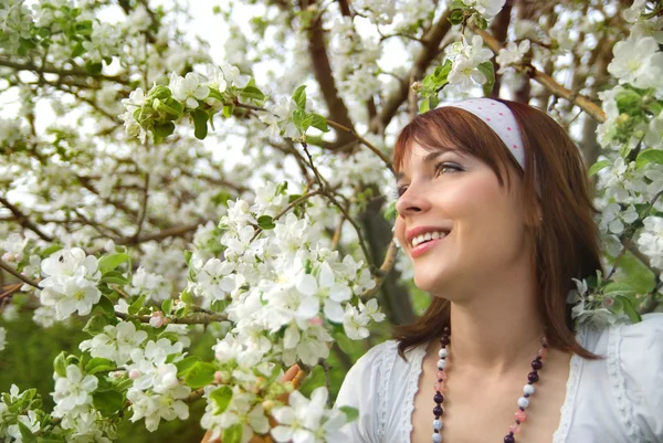 stock image Young girl and apple blossoms