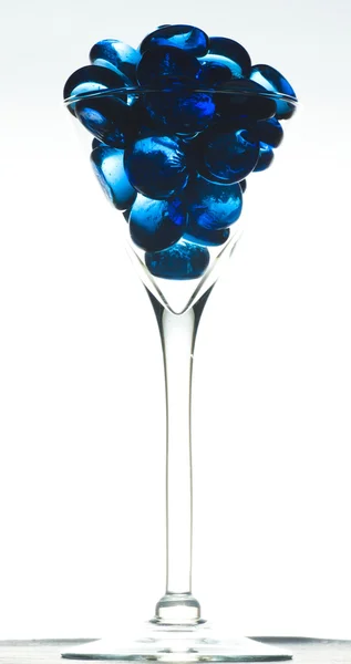 Vidrio con piedra azul — Foto de Stock