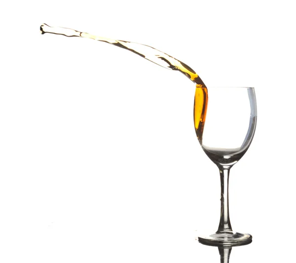 stock image Colored liquid splashing out a glass