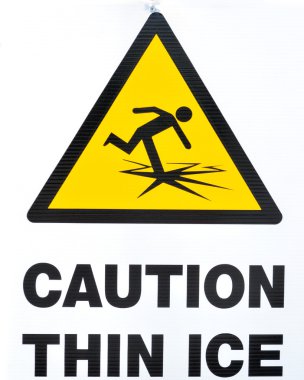 A thin ice warning sign for frozen lakes and rivers. clipart