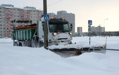 Snow cleaning on the road clipart