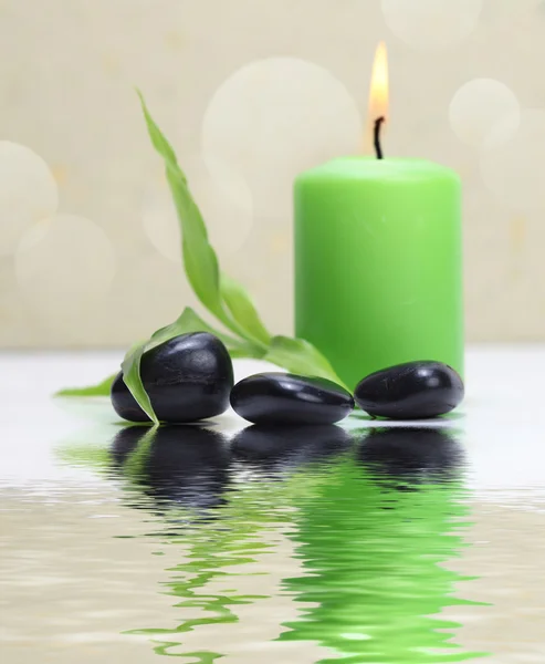 Candle and stones — Stock Photo, Image