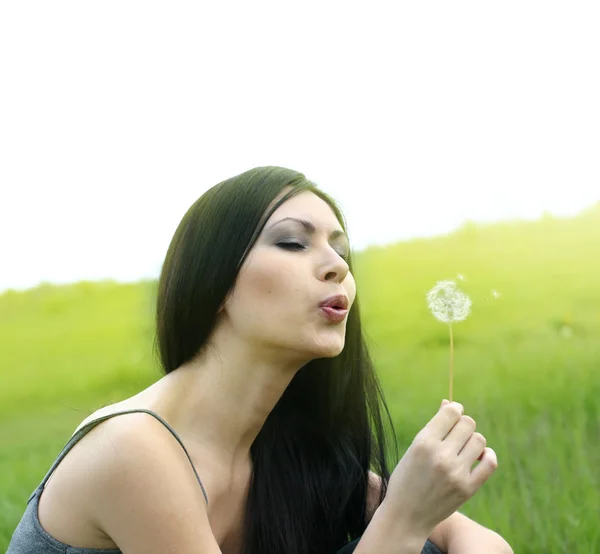 Beautiful woman with dandelion — Stock Photo, Image