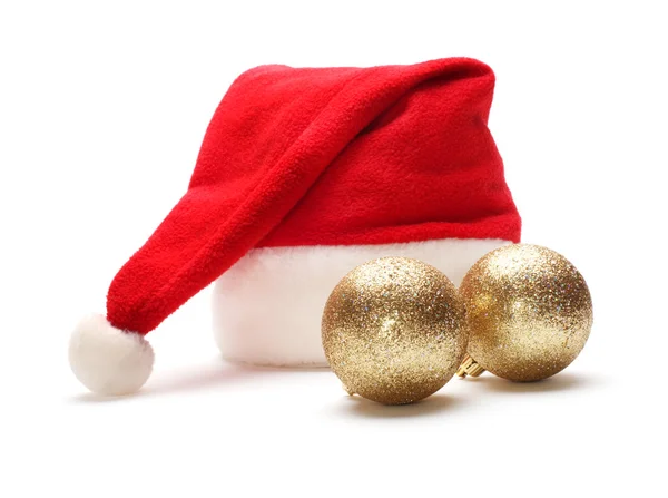 Red santa claus hat and christmas ball — Stock Photo, Image